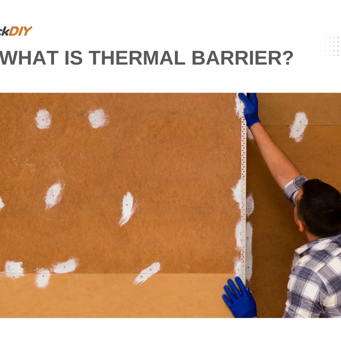 Worker measuring and preparing a thermal barrier installation for fire protection over spray foam insulation.